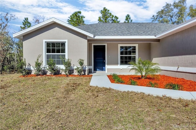 view of front facade with a front lawn