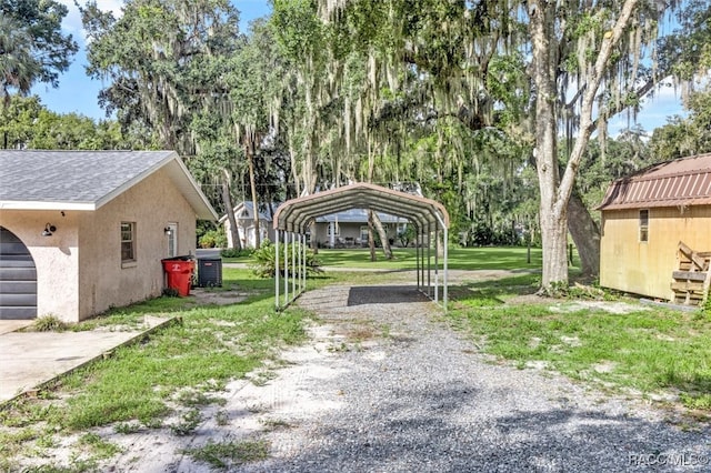 view of yard with a carport