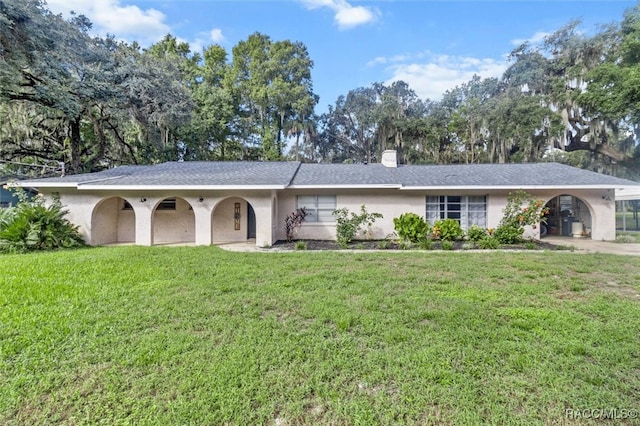 single story home featuring a front yard