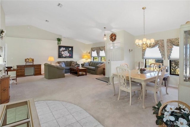 carpeted dining space with lofted ceiling and an inviting chandelier