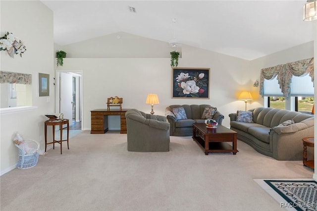 carpeted living room featuring lofted ceiling