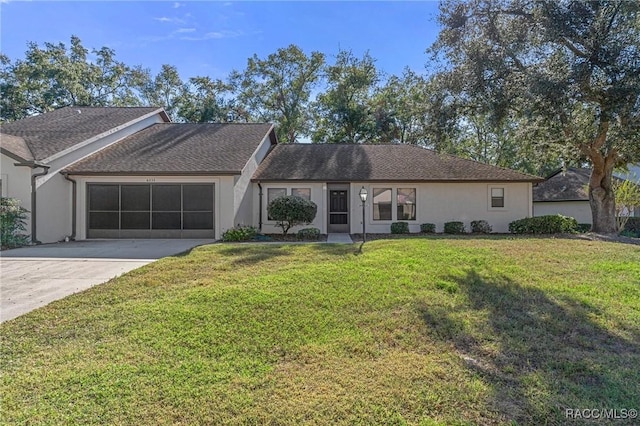 ranch-style home with a garage and a front lawn