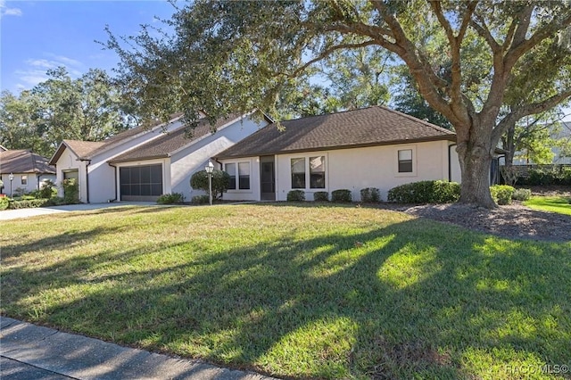 single story home with a front lawn