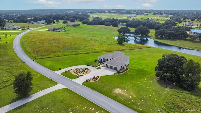 bird's eye view featuring a rural view and a water view