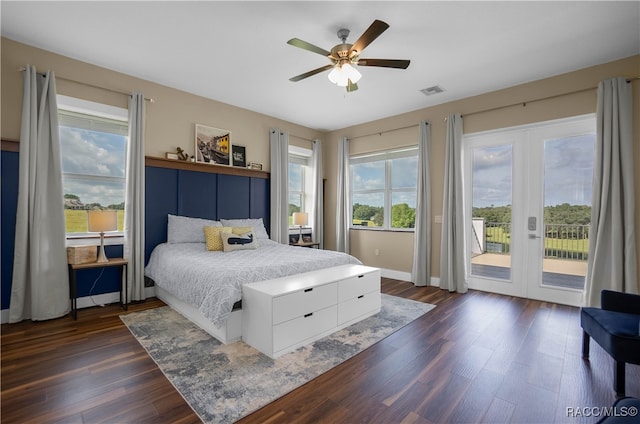 bedroom with visible vents, a ceiling fan, dark wood-type flooring, access to outside, and french doors