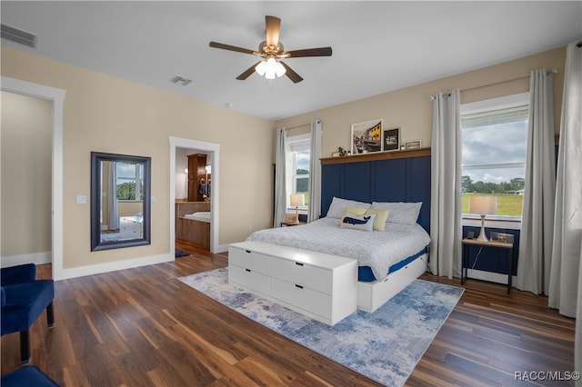 bedroom featuring visible vents, ceiling fan, baseboards, and wood finished floors