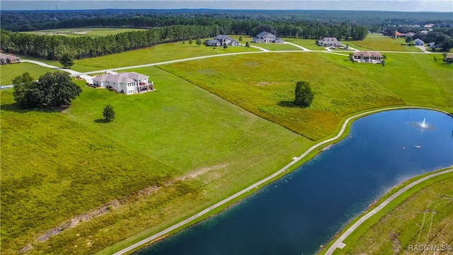 birds eye view of property with a water view and a rural view