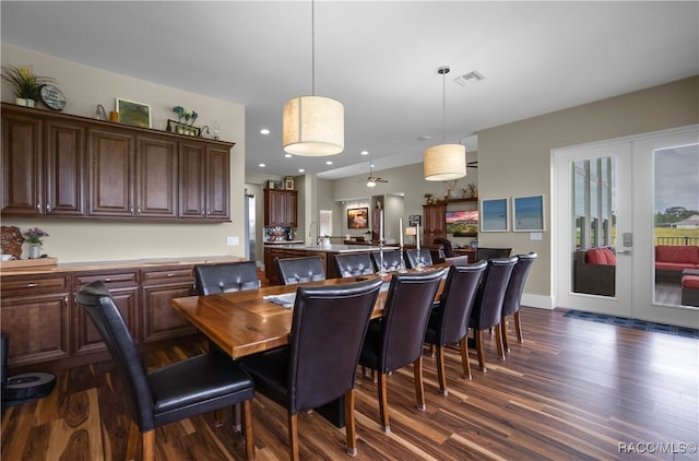 dining room featuring a wealth of natural light, french doors, dark wood-type flooring, and visible vents