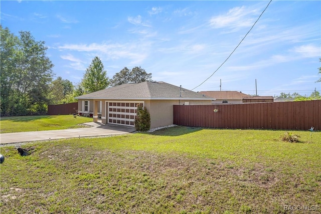 176 Juniper Loop Cir, Ocala, FL 34480 - view of home's exterior with concrete driveway, a garage, and stucco siding