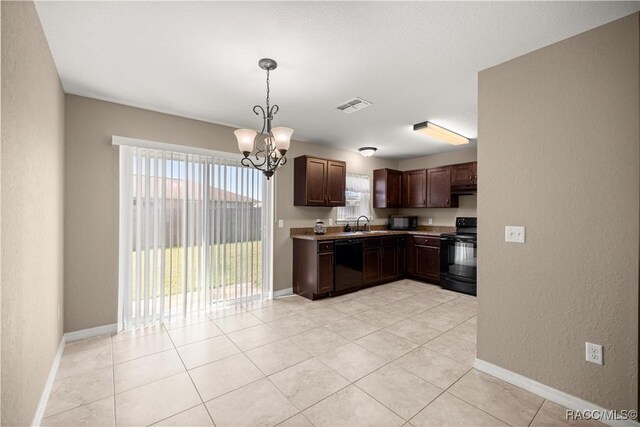 176 Juniper Loop Cir, Ocala, FL 34480 - kitchen featuring black appliances, a chandelier, dark brown cabinetry, a sink, and decorative light fixtures