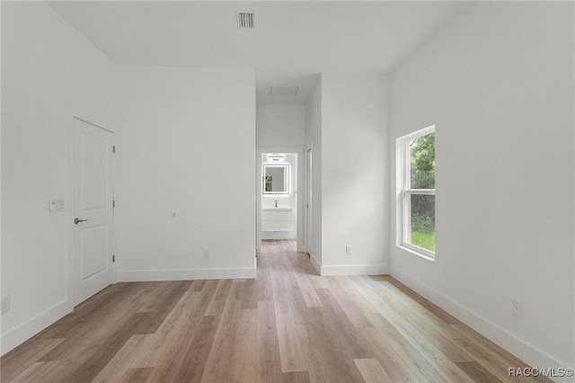 unfurnished room with light hardwood / wood-style flooring