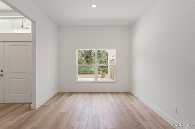 unfurnished room with light hardwood / wood-style floors