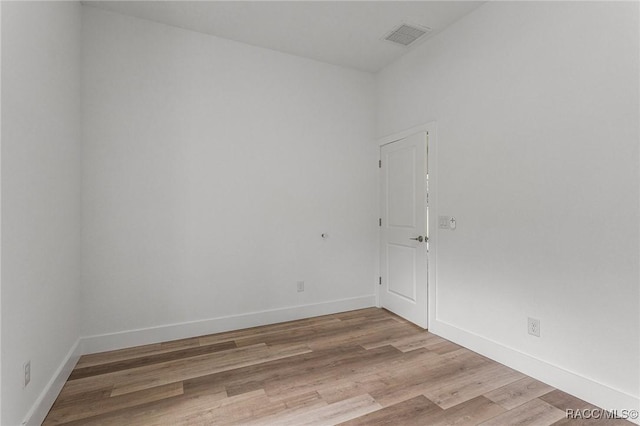 unfurnished room with light hardwood / wood-style floors