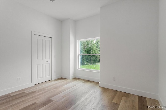 unfurnished room with light hardwood / wood-style floors