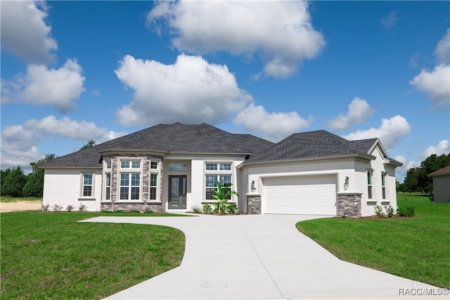 view of front facade featuring a front yard and a garage