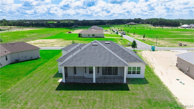 birds eye view of property with a rural view