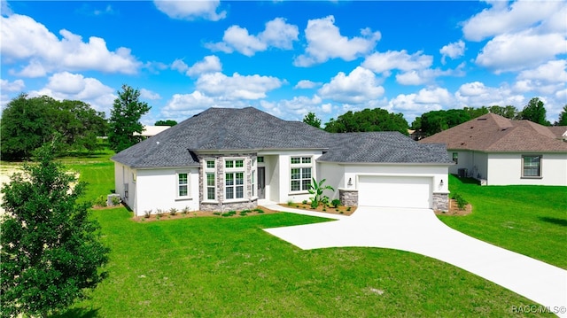 view of front of property featuring a garage and a front yard