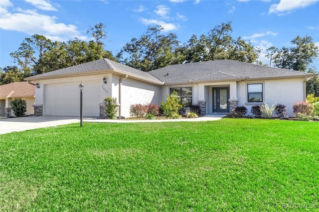 ranch-style home with a front yard and a garage