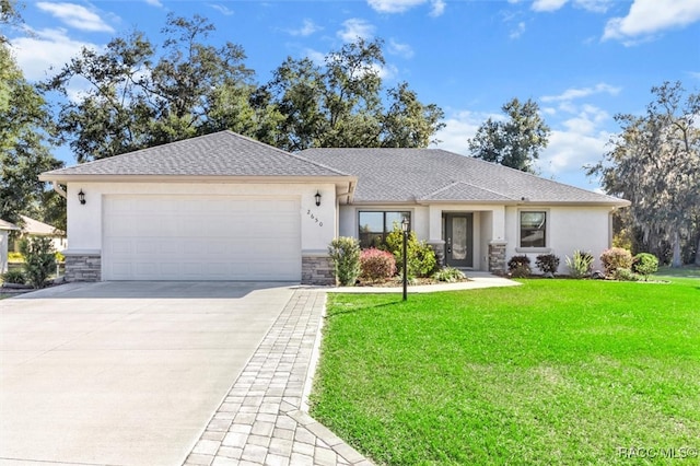 ranch-style home featuring a garage and a front yard