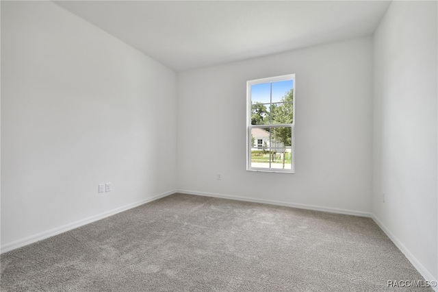 unfurnished room featuring carpet floors