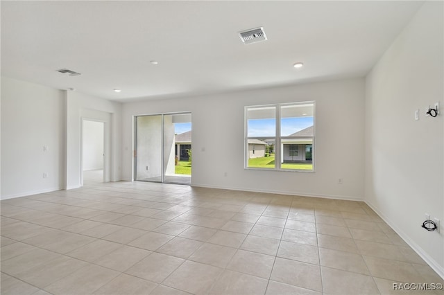 unfurnished room with light tile patterned floors