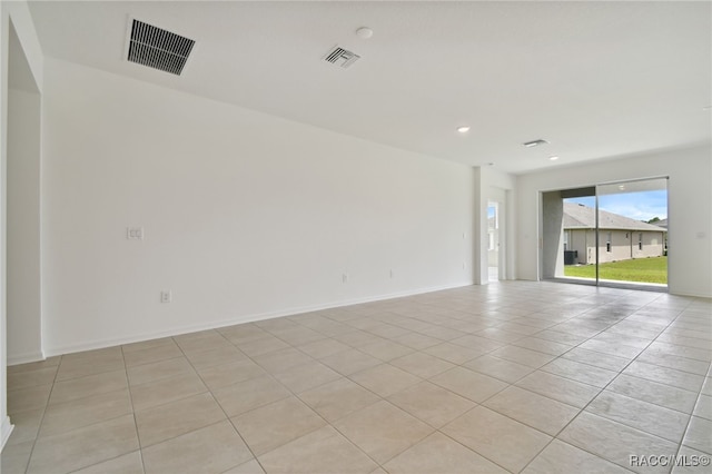 unfurnished room featuring light tile patterned floors