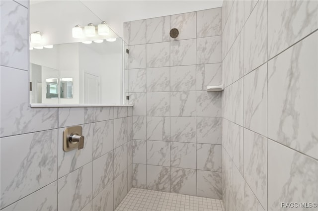 bathroom with a tile shower