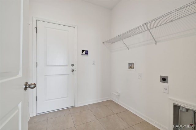 clothes washing area featuring hookup for a washing machine, light tile patterned floors, and electric dryer hookup