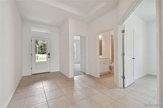 foyer with light tile patterned flooring