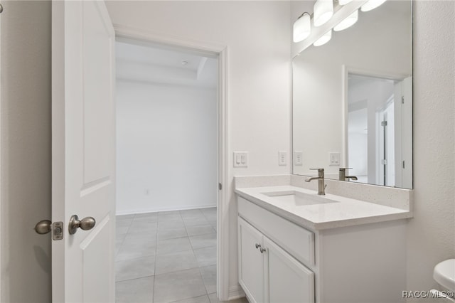 bathroom with tile patterned flooring and vanity