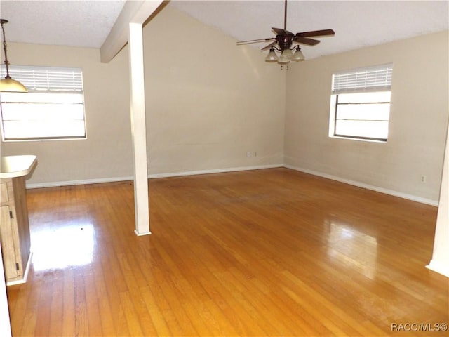 unfurnished room featuring ceiling fan, wood-type flooring, and a textured ceiling