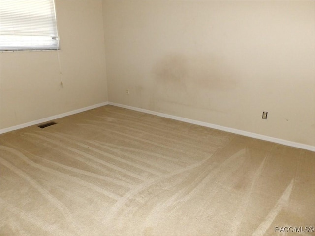 unfurnished room with carpet