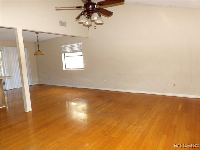 unfurnished room featuring ceiling fan and hardwood / wood-style flooring