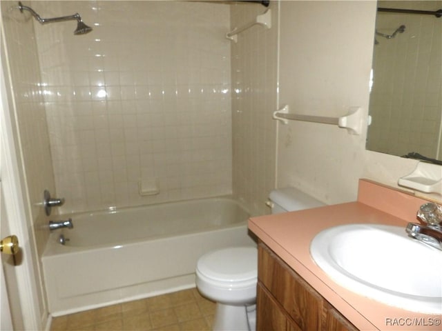 full bathroom with tile patterned floors, vanity, toilet, and tiled shower / bath