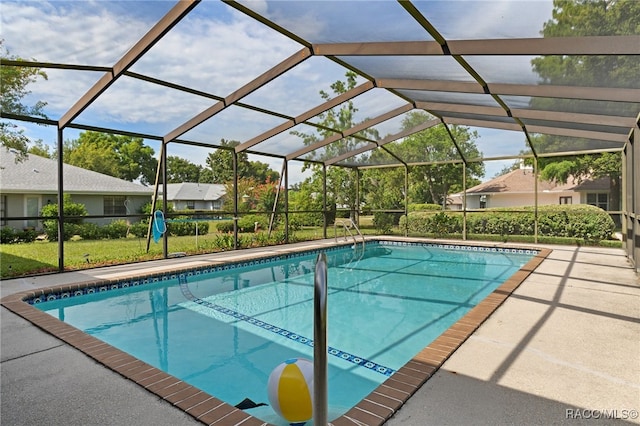 view of pool with a patio and a lanai