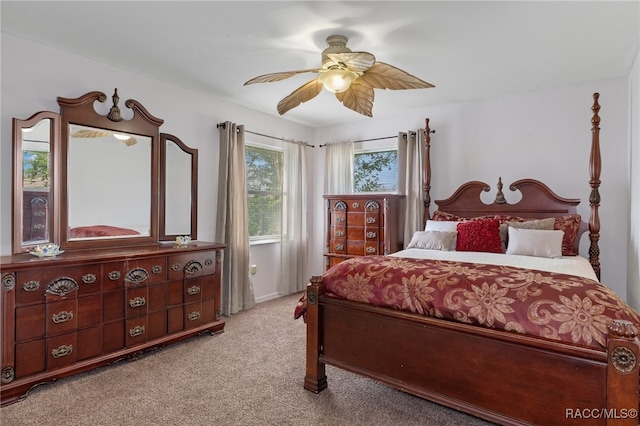 carpeted bedroom with ceiling fan