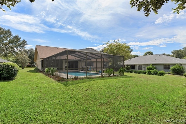 view of yard with glass enclosure