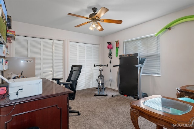 home office featuring light colored carpet and ceiling fan