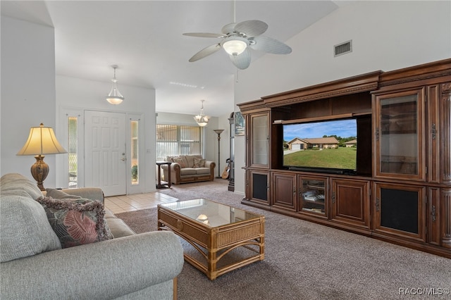 living room with light colored carpet, ceiling fan, and lofted ceiling