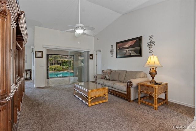 living room with ceiling fan, carpet floors, and vaulted ceiling