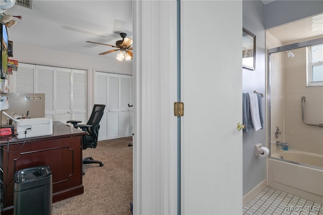 office space featuring light colored carpet and ceiling fan