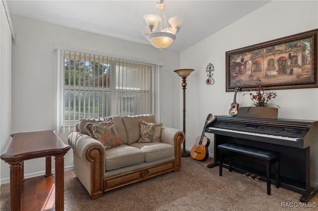 sitting room featuring dark colored carpet and a notable chandelier