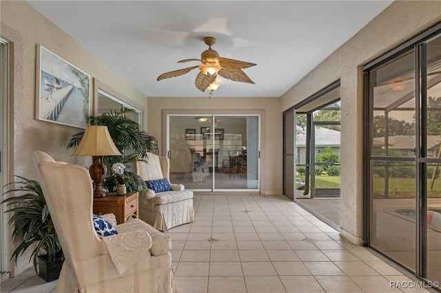 sunroom / solarium with ceiling fan