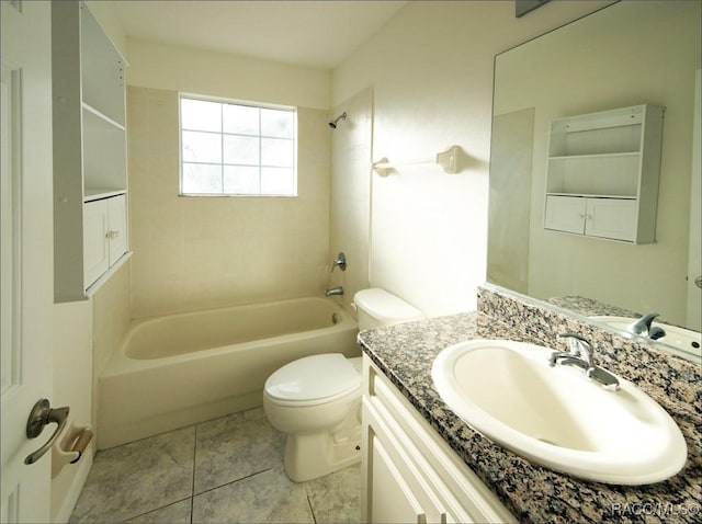 full bathroom featuring vanity, tile patterned floors, tiled shower / bath combo, and toilet