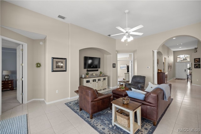 living room featuring light tile patterned floors and ceiling fan