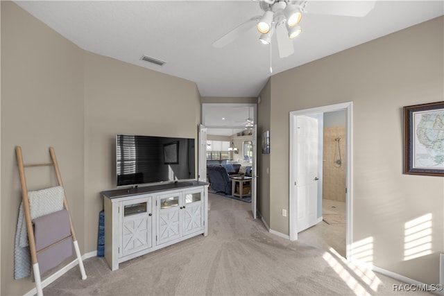 carpeted living room with ceiling fan