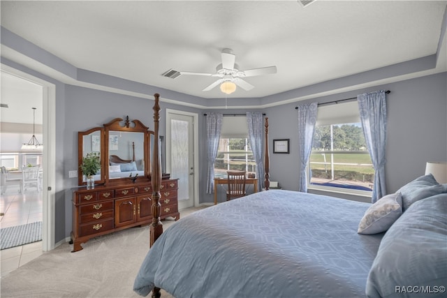 bedroom featuring ceiling fan, access to exterior, and light carpet