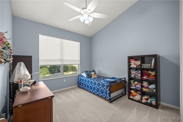 bedroom featuring ceiling fan, lofted ceiling, and light carpet