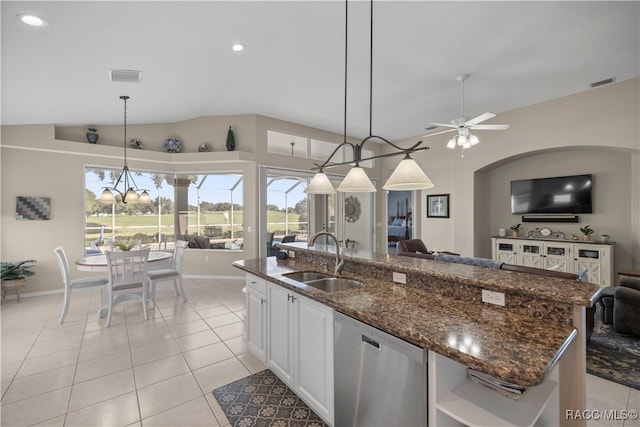 kitchen with white cabinetry, dishwasher, sink, pendant lighting, and lofted ceiling