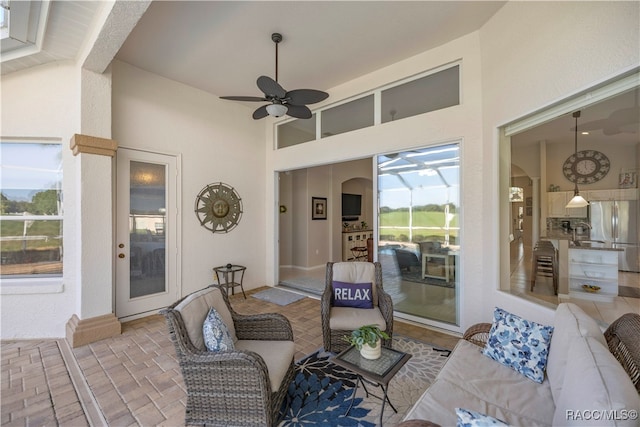 view of patio featuring ceiling fan